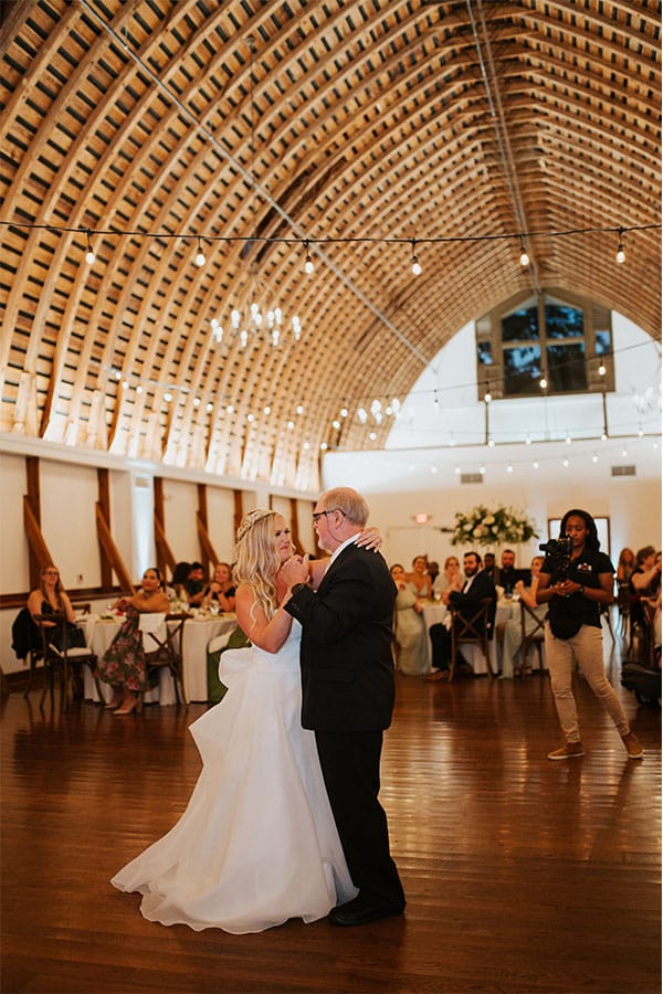 The bride dancing with her father. 