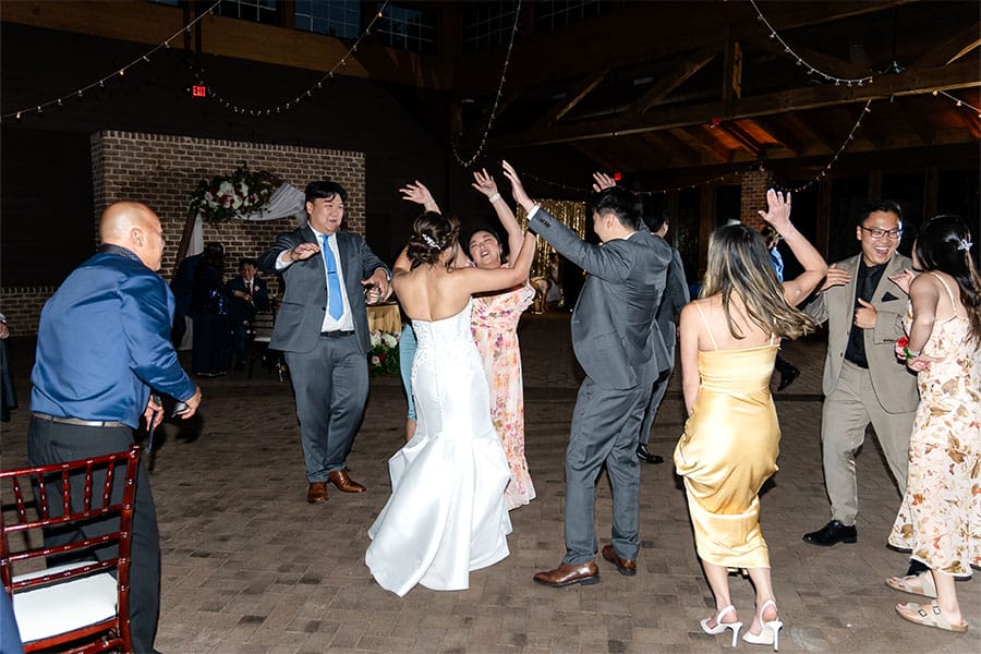 The bride and groom dancing together.
