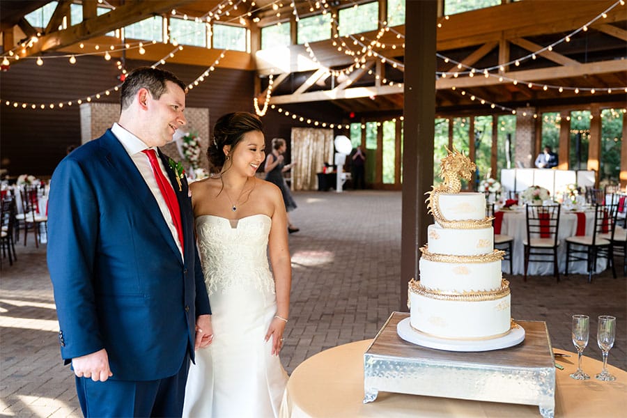The bride and groom cutting their cake.